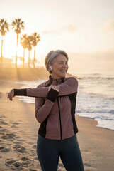 An elderly woman doing stretching exercises outdoors. An active, healthy lifestyle.