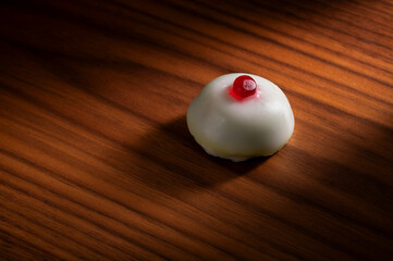 Cassata siciliana dessert on wooden surface