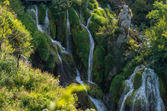 Plitvice Lakes, Croatia - August 16, 2025: Scenic landscape of turquoise lakes and waterfalls in National Park.