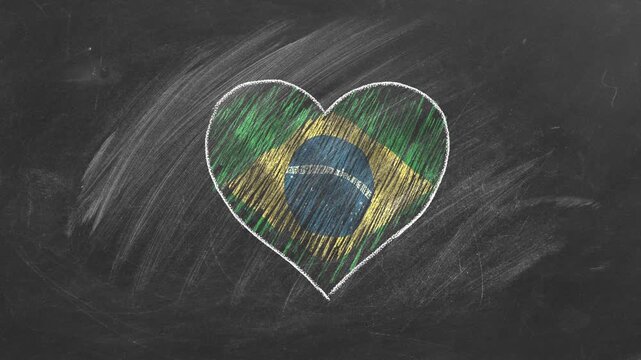 National flag of Brazil in heart shape  drawn with colored chalk on a blackboard.