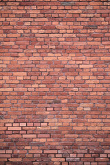 Red brick wall background texture with subtle pattern, vertical backdrop for banners, posters, presentations and web design.