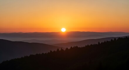 Obraz premium Breathtaking mountain sunset with layered hills and vibrant sky