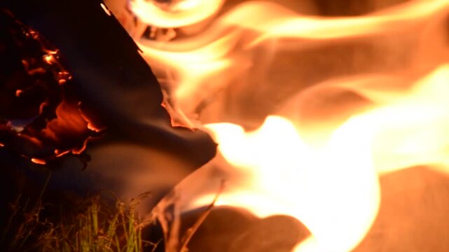 Bright flowing flames with intense orange glow and dark contrast, forming dynamic shapes and heat patterns that express raw energy, motion, power, and a dramatic elemental atmosphere.
