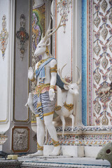 The contemporary stucco artwork in the Ordination Hall of Wat Pariwat Ratchasongkhram blends concepts related to beliefs and philosophy. Located at Bangkok city in Thailand.