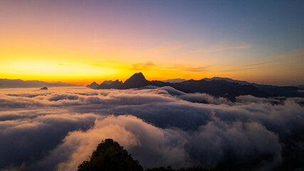 The view of the sunrise in the morning, with mist and mountains, is a beautiful natural landscape in northern Thailand, in Tak province.
