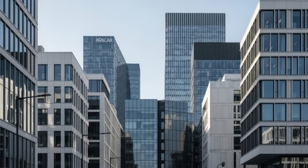 Obraz premium Modern city skyline with contemporary architecture against a clear blue sky