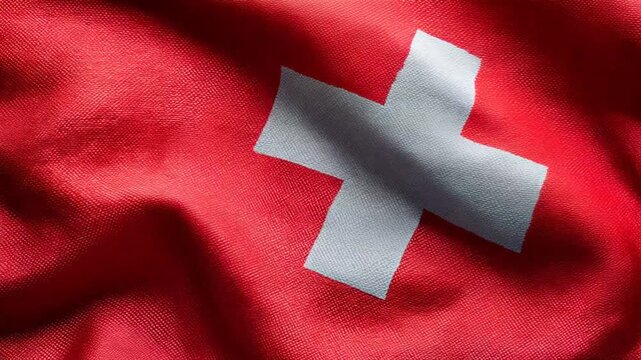 swiss flag waving in the wind. flag of switzerland