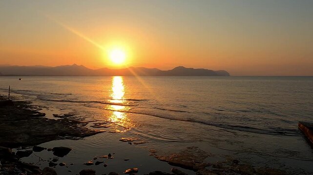 Sunset at the beach in Aspra, Sicily. Italy