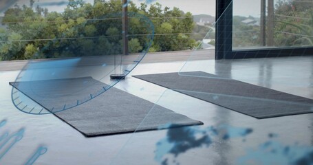 Two mats lying on polished concrete floor in studio by glass wall, round sensor and HUD