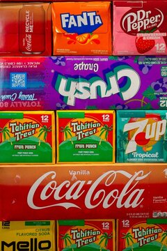 Niagara-on-the-Lake Canada - 18 December 2025 - Carton boxes of pop lemonade soft drinks piled on top of each other in a colourful display