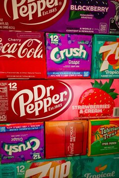 Niagara-on-the-Lake Canada - 18 December 2025 - Carton boxes of pop lemonade soft drinks piled on top of each other in a colourful display
