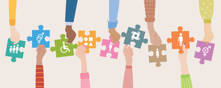Hands holding puzzle pieces with inclusion icons representing gender equality, disability support and diverse community.