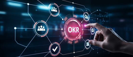Fototapeta premium Close up view of hand touching okr symbol on dark futuristic screen displaying connected business icons for human resources team management and strategic result tracking technology