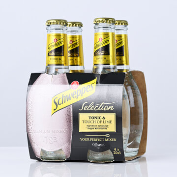 Package of Schweppes tonic water on white background