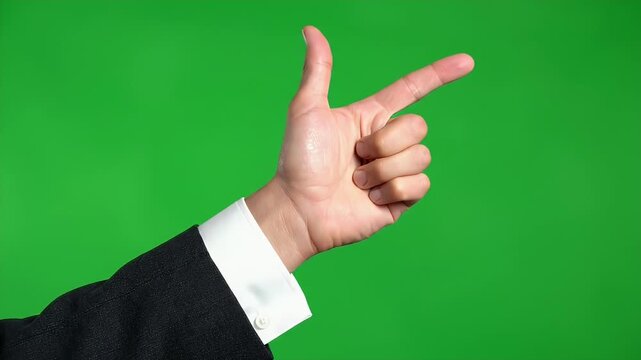 A person in a dark suit and white shirt points with index and middle fingers