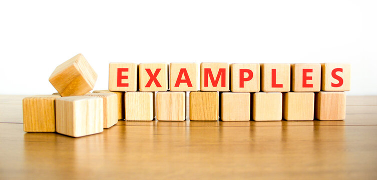 Example examples word symbol. Concept word Examples on beautiful wooden blocks. Beautiful wooden table white background. Business example examples word concept. Copy space.