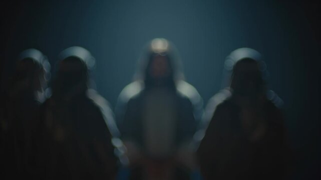 Man portraying Jesus Christ surrounded by accusers, with gestures changing from indictment to blurred judgment, representing suffering and passion.