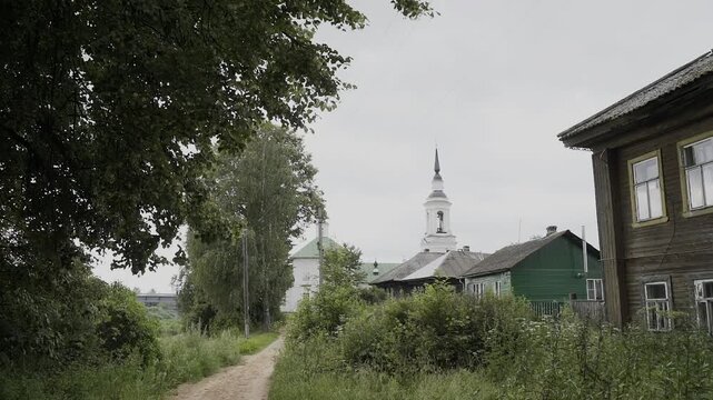 A village with wooden houses and a church