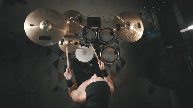 Top down view of professional drummer playing drums