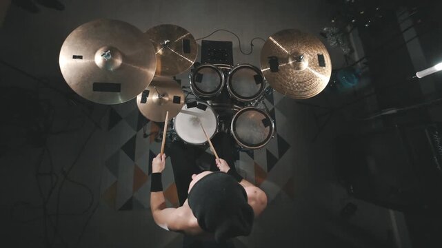 Top down view of professional drummer playing a drum kit