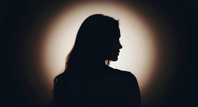Silhouette of a mysterious woman in a spotlight (स्पॉटलाइट में एक रहस्यमय महिला का सिल्हूट)