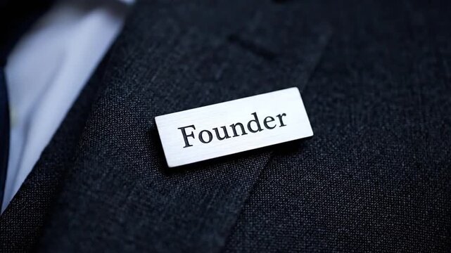 Founder business badge on professional suit jacket