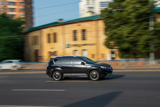 Ukraine, Kyiv - 16 Jule 2021: Black Mitsubishi Outlander car moving on the street. Editorial