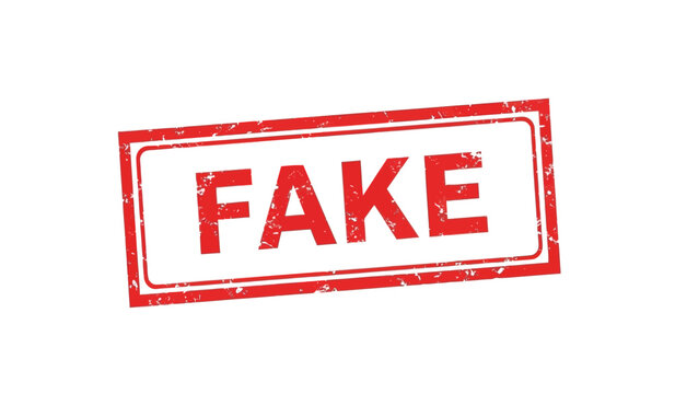 A red rubber stamp with the word fake on a for marking documents as counterfeit or unoriginal