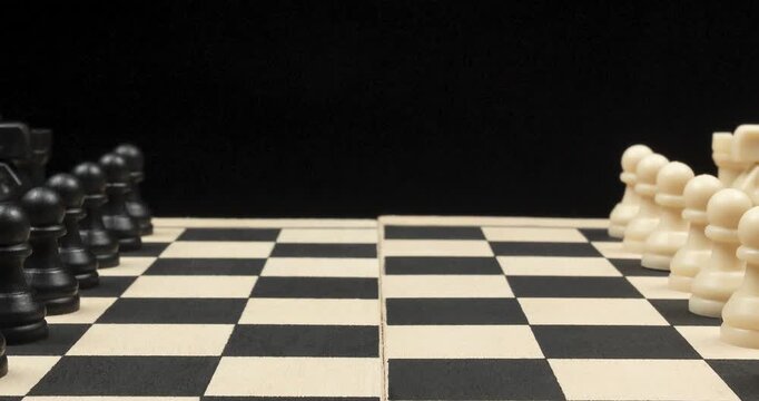 a Zoom out of a chess board with a white and black pieces and a black background