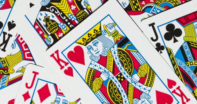 A common card deck face cards background rotating