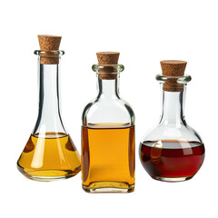 Three glass bottles containing oil and vinegar on a white background