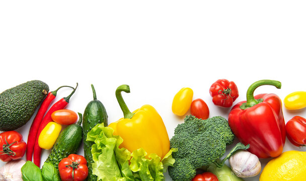 Fresh healthy vegetables creating nutritious food border on white