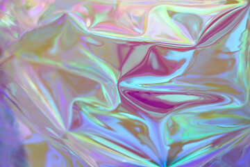Obraz premium Iridescent holographic texture with colorful, reflective waves and dreamlike light for artistic projects