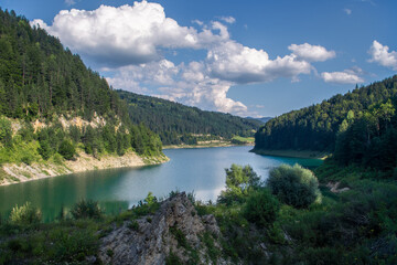 Obraz premium Zaovinsko Lake on Tara mountain surrounded by mountain peaks. Beautiful nature in western Serbia.