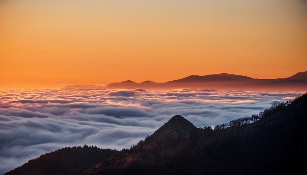 Warm Sunset Illuminates Mountaintop Above Swirling Cloud Inversion Ethereal Glow Golden Hour Magical