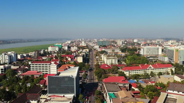 High angle of Wat Si Muang buddhist temple complex in Vientiane Laos with traditional architecture and lush trees