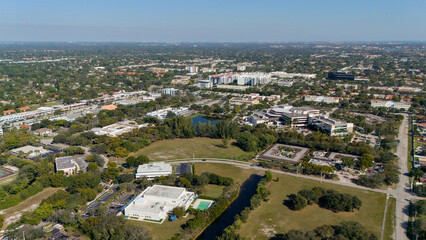 Fototapeta premium Drone shot of buildings trees and canal in Coral Springs Florida