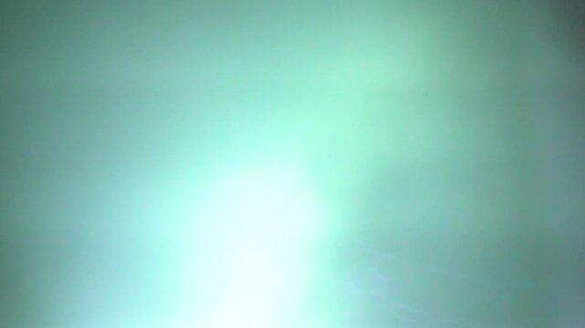 Abstract green and blue gradient background with soft light and textured pattern
