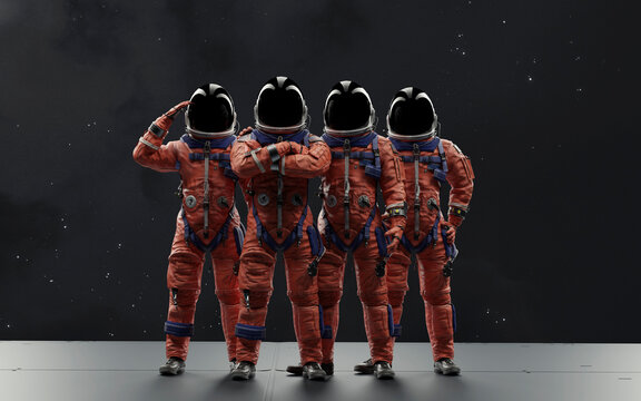 The four-person crew of the Artemis II mission stands ready for their historic lunar flyby in their orange OCSS suits, ready to return humanity to the Moon
