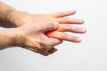 Hand pain, close-up of male hands on a white background
