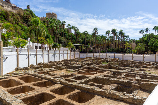 Ancient Roman and Phoenician Fish Salting Factory Ruins at El Majuelo Park in Almunecar Spain featuring Castillo de San Miguel in the Background