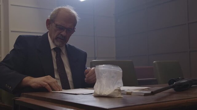 Criminal Trial lawyer in court pointing to notes - modern court room scene