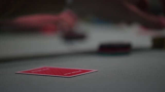 Close up view of two cards during a Texas hold 'Em poker game with defocused background