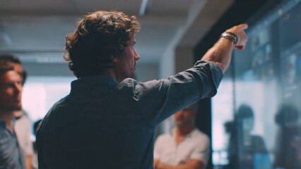 Man presenting to colleagues on screen