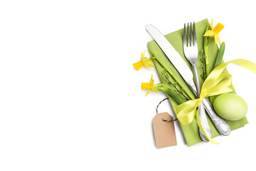 Easter table setting. Beautiful silverware floral decor and painted egg isolated on white, top view