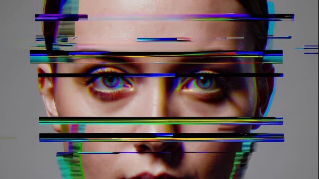 A close-up video of a man's face with futuristic digital glitch effects overlaying his eyes and mouth.