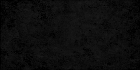 Obraz premium A dark and textured grunge wall background featuring a vintage gray concrete surface with an aged stone pattern and rough black paper backdrop for a dirty industrial design