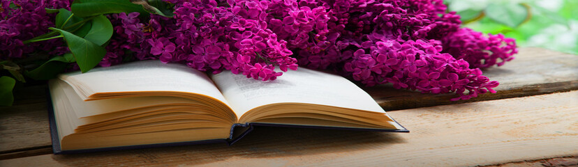 Lilac and book on the table