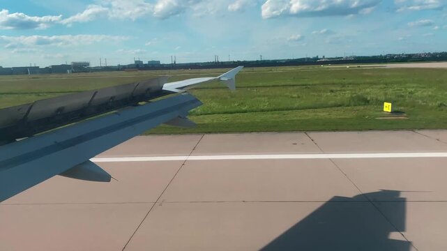 Airplane Window View Over Fields and Cities During Landing Approach