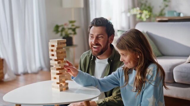 Family playing tabletop game relaxed weekend leisure in apartment closeup.